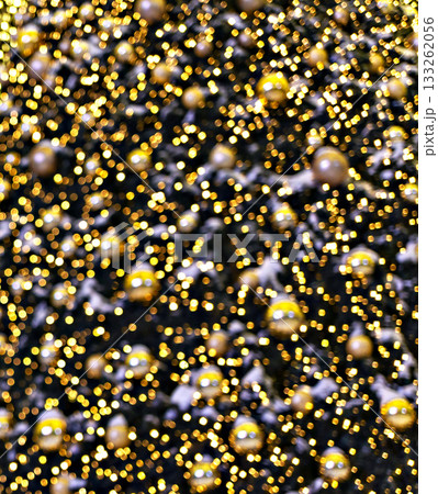 Christmas tree decorating golden balls and garland lights blurred background New Year holidays copy space 133262056