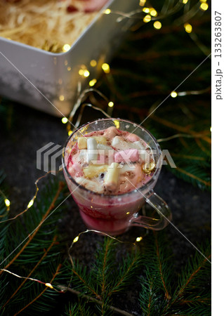 Festive Dessert With Marshmallows, Whipped Cream, and Milk Being Poured in a Cozy Holiday Setting With Twinkling Lights Festive Dessert With Marshmallows, Whipped Cream, and Milk Being Poured in a Cozy Holiday Setting With Twinkling Lights 133263807