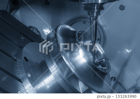 The 5-axis CNC milling machine cutting the aerospace part with solid flat nose end mill tool in the light blue scene. 133263990