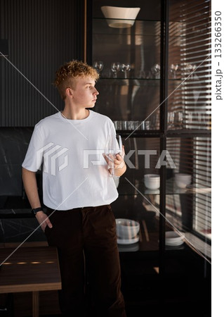 Man drinks wine, Casual moment of man relaxing with wine Man drinks wine, Casual moment of man relaxing with wine 133266350