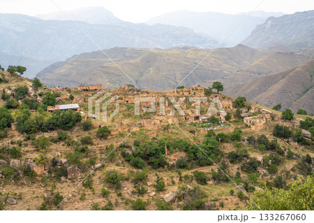 A mountain range with a village in the middle 133267060