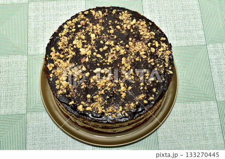 Sponge cake with cream and chocolate fondant. 133270445