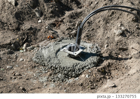 Concrete Base with Cable on Construction Site 133270755