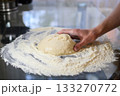 Making Fresh Yeast Dough by Hand with Flour on Kitchen Table, Close Up Process 133270772