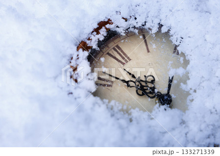 hidden vintage timepiece, weathered antique clock with roman numerals discovered amidst snowdrifts hidden vintage timepiece, weathered antique clock with roman numerals discovered amidst snowdrifts 133271339