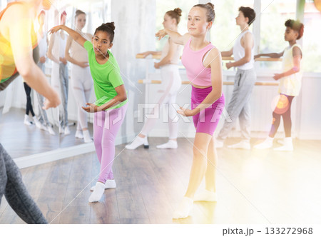 Group of teenage dancers training ballet in studio 133272968