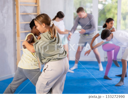 Boy and girl practicing self-defense techniques 133272990