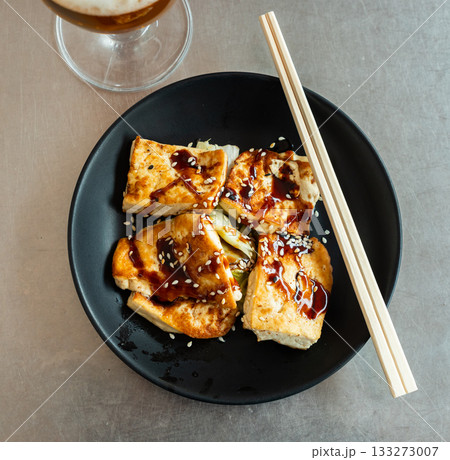 Chinese salad of stewed vegetables and tofu cheese. 133273007
