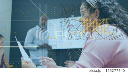 Interacting woman in pink blouse headband using clear display in office with printout, copy space 133277840