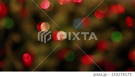 Displaying cluster of blurred colorful bokeh lights in abstract close-up, with string lights 133278173