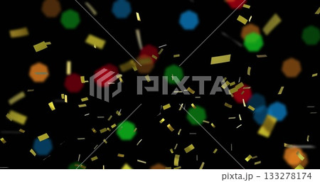 Floating gold confetti pieces and blurred red green blue orange bokeh circles in black backdrop Floating gold confetti pieces and blurred red green blue orange bokeh circles in black backdrop 133278174