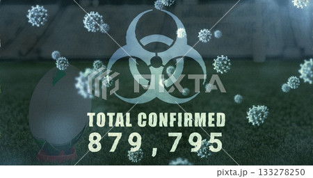 Displaying biohazard symbol with TOTAL CONFIRMED 879,795 on pitch with virus particles, teed ball 133278250