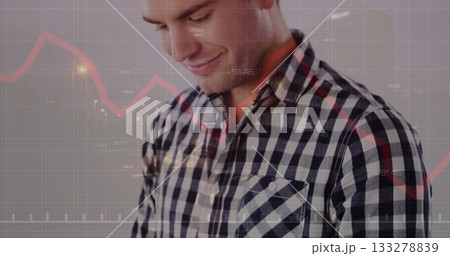 Analyzing checkered shirt man reviewing red line graph in studio, with gridlines and axis labels Analyzing checkered shirt man reviewing red line graph in studio, with gridlines and axis labels 133278839