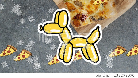 Floating yellow balloon-dog graphic on countertop, with cutting board pizza slices and snowflakes 133278970