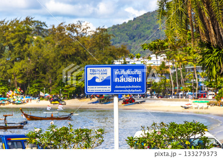 Evacuation route arrow beach direction sign signs Patong Phuket Thailand. 133279373