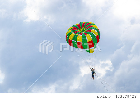 Patong Beach Phuket with parachute sport and parasailing activity Thailand. 133279428