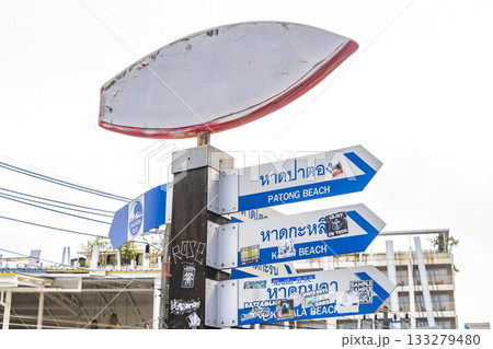 Surfboard and arrow beach direction sign signs Patong Phuket Thailand. Surfboard and arrow beach direction sign signs Patong Phuket Thailand. 133279480