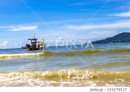 Longtail boat long tail boats at the Patong Beach Thailand. 133279517