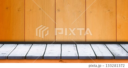 Flat design whitewashed wooden platform sitting against honey wood plank wall with black ledge 133281372