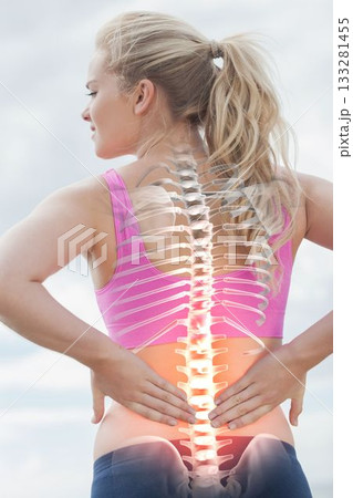 Highlighted spine of woman with back pain Highlighted spine of woman with back pain 133281455