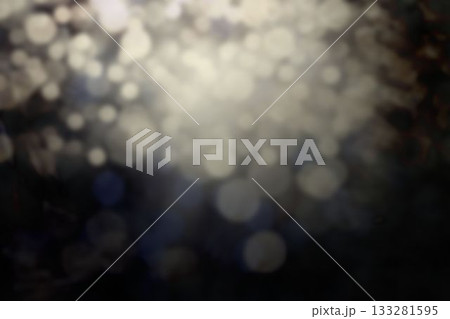 Abstract circular light spots are floating over dark blurred background, flat design Abstract circular light spots are floating over dark blurred background, flat design 133281595
