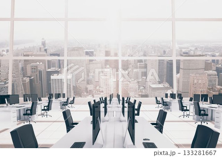 Displaying open-plan office interior in flat design, featuring white desks, black chairs, monitors 133281667