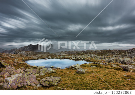 Landscape with small lake in the high mountains 133282868
