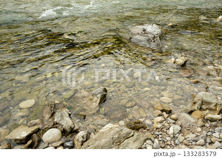 River Flow Over Rocky Bottom, Natural Water Background River Flow Over Rocky Bottom, Natural Water Background 133283579