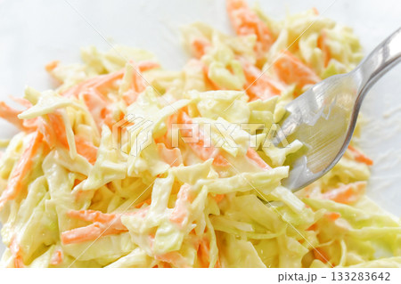 Coleslaw salad on fork. Coleslaw salad on fork. 133283642