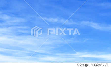 Blue pastel sky with white fluffy cloud.  133285227