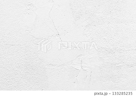 White concrete wall texture background. Uneven render stucco white painted concrete wall texture background. Rough and grunge wall in the sun. 133285235