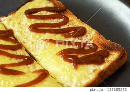 Cheese on toast with brown sauce. Cheese on toast with brown sauce. 133285256