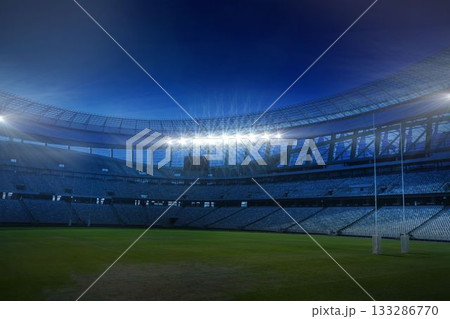Rugby goalposts are standing in flat design nighttime stadium, with curved seating and floodlights 133286770