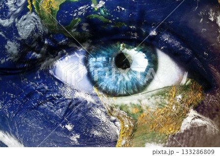 Digital illustration is merging blue eye with satellite Earth view, showing continents and clouds 133286809