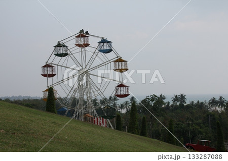 Ferris wheel on the hill in the park, Krabi, Thailand Ferris wheel on the hill in the park, Krabi, Thailand 133287088