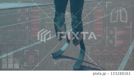 Teenage athlete wearing black leggings running in red track lane, with carbon-fiber blades and HUD 133288161