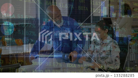 Four professionals discussing financial data in corporate office, with laptop smartphone and tablet 133288285
