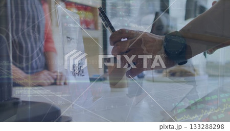 Scanning laptop QR code with hand holding smartphone stylus at office table, documents, coffee cup 133288298