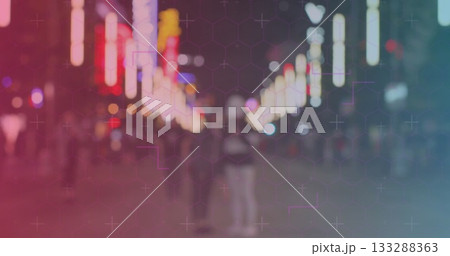 Walking blurred pedestrians moving through night city street, with neon signs and streetlights 133288363