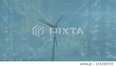 Showing wind turbine rising over dusk skyscraper-lined skyline, with digital line graph overlays Showing wind turbine rising over dusk skyscraper-lined skyline, with digital line graph overlays 133288550