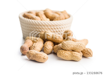 Peanuts in shell. Groundnuts in bowl isolated on white background. Peanuts in shell. Groundnuts in bowl isolated on white background. 133288676