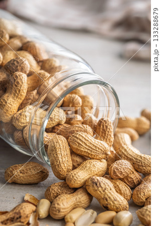 Peanuts in shell. Groundnuts in jar on kitchen table. Peanuts in shell. Groundnuts in jar on kitchen table. 133288679