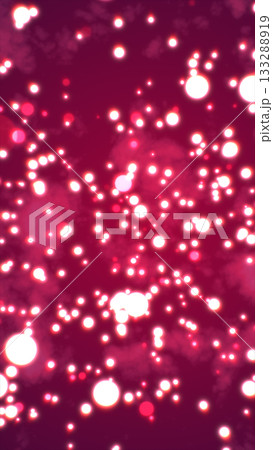 Vivid glowing pink bokeh particles floating through a hazy atmospheric background with dreamy soft light 133288919