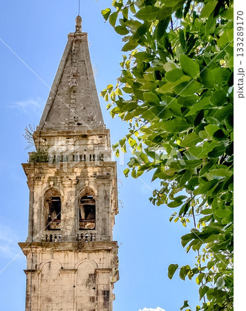 A Historic Bell Tower Admired Against a Clear Blue Sky, Capturing Attention and Wonder A Historic Bell Tower Admired Against a Clear Blue Sky, Capturing Attention and Wonder 133289170
