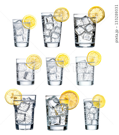 A glass filled with sparkling water, ice cubes, and a slice of lemon isolated on white transparent. A glass filled with sparkling water, ice cubes, and a slice of lemon isolated on white transparent. 133289331