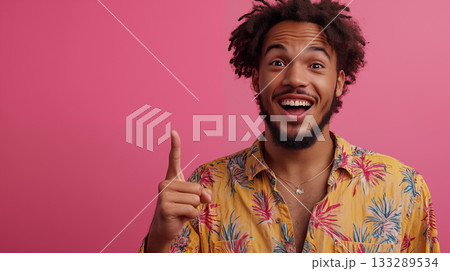 Young man gesturing excitedly against pink background, positive energy concept 133289534
