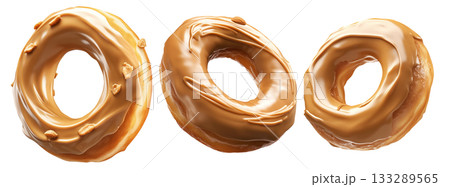 Tasty caramel-glazed donut topped with crunchy nuts, isolated on white transparent background Tasty caramel-glazed donut topped with crunchy nuts, isolated on white transparent background 133289565