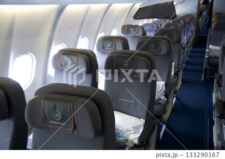 Frankfurt, Germany, June 10, 2019: Premium Economy Cabin with Multiple Seat Rows on a Long Haul Aircraft Frankfurt, Germany, June 10, 2019: Premium Economy Cabin with Multiple Seat Rows on a Long Haul Aircraft 133290167
