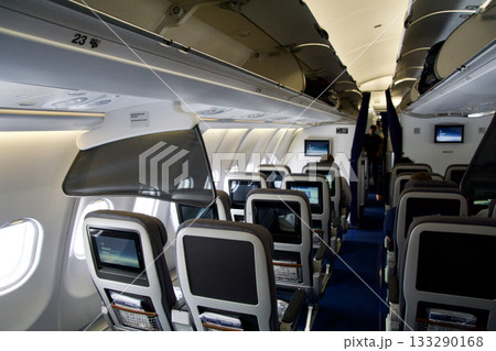 Frankfurt, Germany, June 10, 2019: Premium Economy Cabin with Multiple Seat Rows on a Long Haul Aircraft 133290168