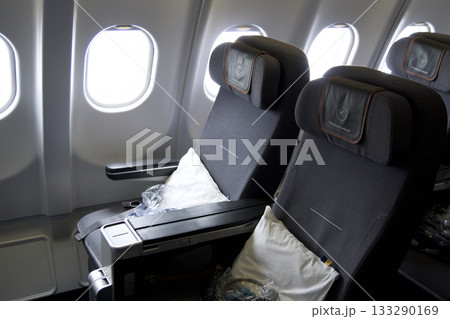 Frankfurt, Germany, June 10, 2019: Premium Economy Seats by the Window on a Long Haul Aircraft Frankfurt, Germany, June 10, 2019: Premium Economy Seats by the Window on a Long Haul Aircraft 133290169